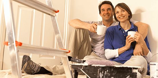 couple taking a coffee break from home renovations