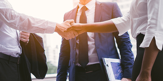 Man and female shaking hands for a business deal