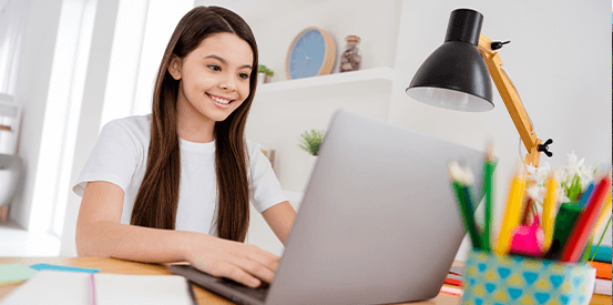 Girl on laptop smiling