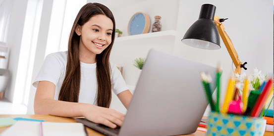Financialliteracyteam 553X275 Girl on laptop smiling