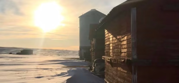 winter sunset with grainary and barn