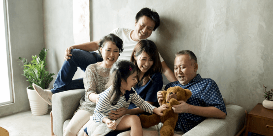 family and grandparents on couch