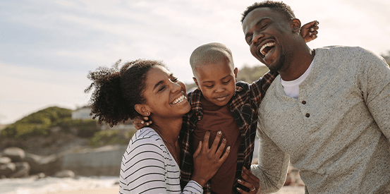 family having fun at the beach