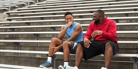 Coaching_553X275 two people laughing