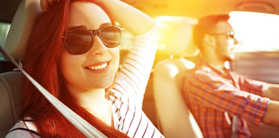 couple driving on a sunny day
