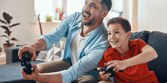 Financial Strength Video Game 553X275 dad and son playing video games