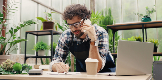 Male florist on the phone 