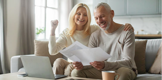 couple-reviewing-documents-on-couch